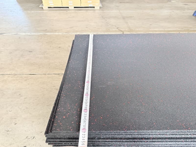 professional installing rubber flooring with glue